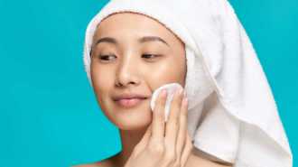 asian-woman-naked-shoulders-clean-skin-scrub-close-2023-11-27-05-05-14-utc-min (1)